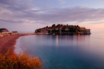 Beautify view on Sveti Stefan island, sea and coastline in Montenegro in the sunset. Popular travel destination.