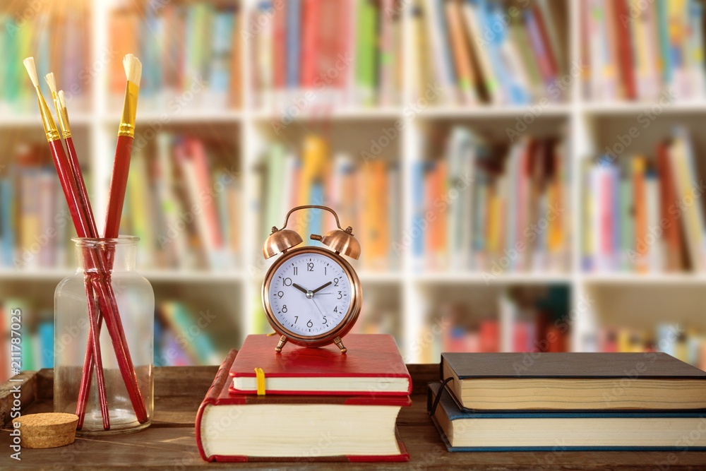 Poster composite image of books with alarm clock with books and