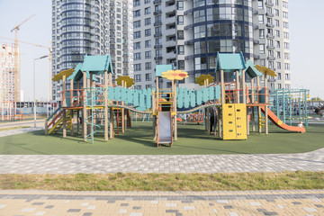 Fototapeta na wymiar New children's playground near a apartments building.