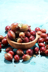 Fresh gooseberries on table. A crop of ripe gooseberry.