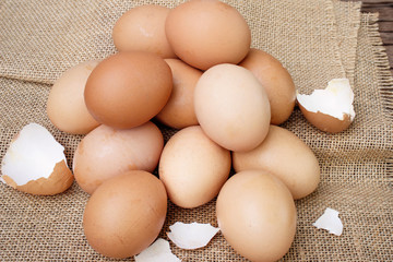 Fresh eggs on wooden background