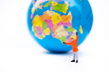 Miniature people, engineer working standing with mini earth background using as business, discover and industry concept
