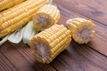 Fresh sweet corn on table