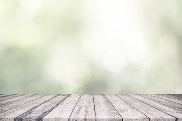 Wood table top and abstract nature blurred bokeh
