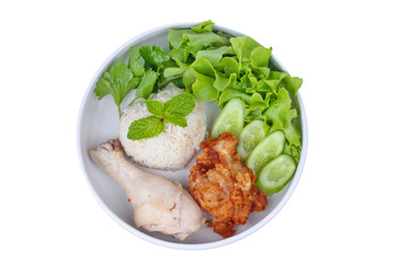 Streamed oily Jasmine rice and streamed chicken call as Hainanese chicken rice and deep fried chicken topped mixed vegetable.