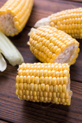 Fresh sweet corn on table