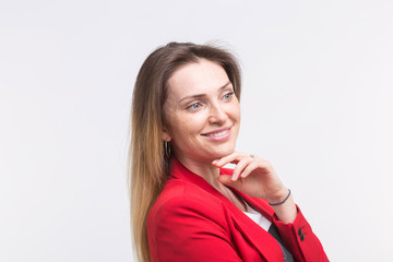 fashionable young woman posing in red suit