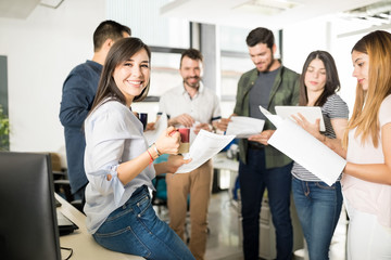 Business team going through some paperwork in office