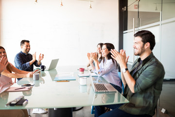 Business team clapping after a meeting