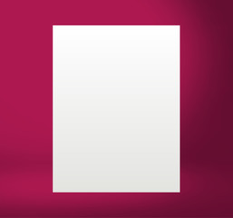 White paper sheet Standing in the red lit room on the table. Template mock up for display of product or your content. Business background.