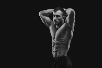Naklejka na ściany i meble Strong athletic man showes naked muscular body