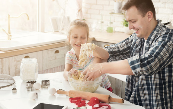 Father Is Cooking Pastry With Daughter