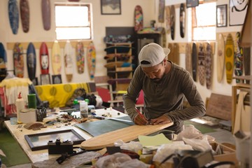 Man making skateboard