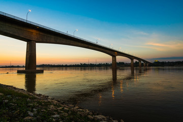 Thai-Laos Friendship Bridge on sunset background