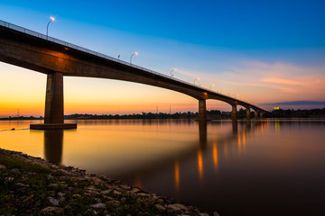 Fototapeta na wymiar Thai-Laos Friendship Bridge on sunset background
