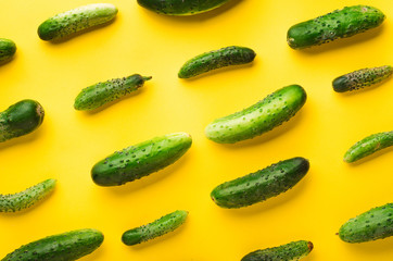 Cucumbers on a yellow background