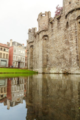moat with water in front of the castle, Ghent Belgium