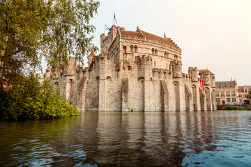 Fototapeta na wymiar moat with water in front of the castle, Ghent Belgium