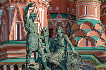 Moscow, Russia. Pozharsky and Minin bronze monument on the Red Square. St. Basils cathedral on background.