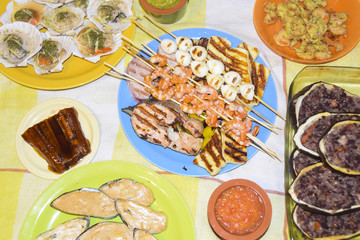 Greek meze a lot of food sauces skewers seafood shrimp fish mussels eggplant meat