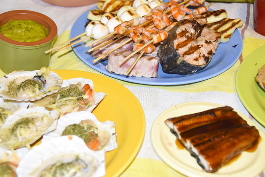 Greek meze a lot of food sauces skewers seafood shrimp fish mussels eggplant meat