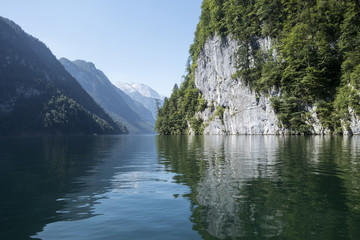 Fototapeta na wymiar Scenic waterway with trees and mountains