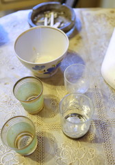 Obraz na płótnie Canvas a glass and a mug on the table