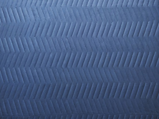 clean quilted chevron pattern on cool gray moving blanket or elevator tarp