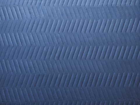 clean quilted chevron pattern on cool gray moving blanket or elevator tarp
