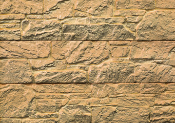 texture and structure of stone, tile, brown wall of blocks of decorative stone