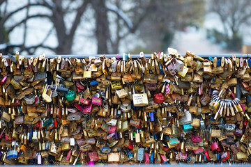 Love padlocks at Pont de l'Archeveche in Paris. The thousands of locks of loving couples symbolize love forever.