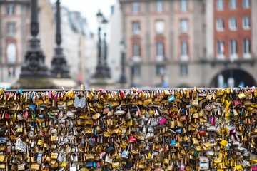 Love padlocks at Pont de l'Archeveche in Paris. The thousands of locks of loving couples symbolize...