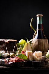 Italian antipasti on wooden table