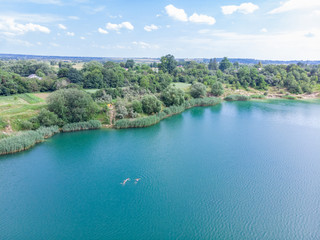 Fototapeta premium aerial view of lake with blue water and sand beaches