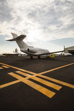 Private jet with trolley at terminal