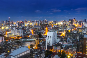 Naklejka premium cityscape Bangkok skyline in Twilight night view, Thailand. Bangkok is metropolis and favorite of tourists live at between modern building / skyscraper, Community residents