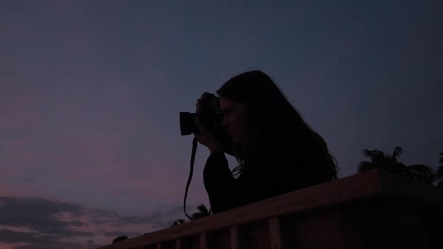 Photographer Silhouette against Evening Sky Sunset