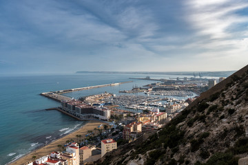 Fototapeta na wymiar Aerial view of Alicante city from Santa Barbara Castle, showing El Postiguet beach and marina
