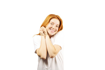 Fototapeta premium Beautiful redheaded young woman with satisfied facial expression, isolated on white background. Attractive female with natural red hair & brown eyes showing sincere smile & perfect teeth. Copy space.