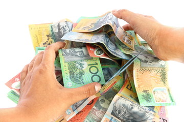 Asian woman hand taking group of colorful australian money banknote dollar (AUD) pile on white background