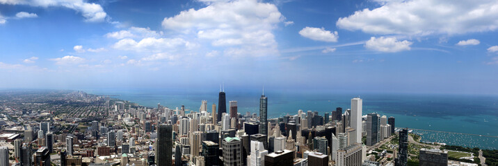 panoramic city of chicago high up skyline blue puffy clouds