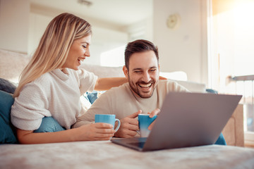 Cheerful couple enjoying at home