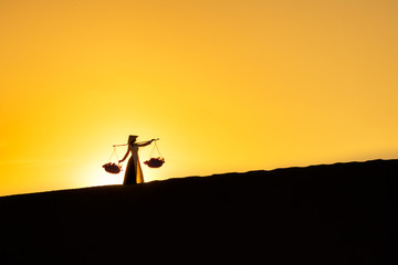 silhouette of vietnam woman wearing ao dai culture traditional dress at red sand mui ne during sunset, mui ne vietnam.