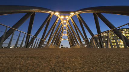 Modern bridge at dusk in Amsterdam, Netherlands