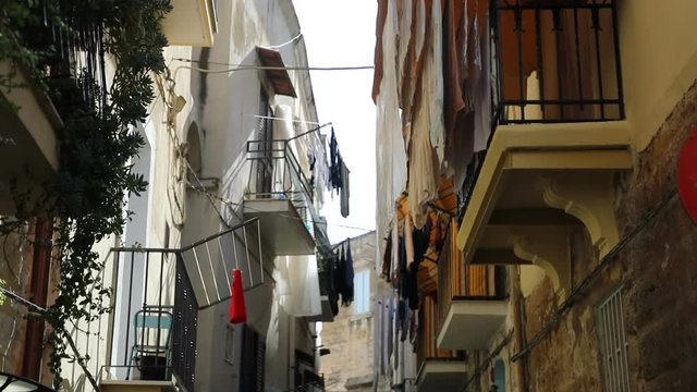 View of a narrow sunny street in the city Bari, Italy