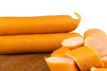 sausages slice on chopping board wood isolated on white background