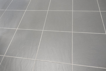 grey textured slate rock big tile flooring with white grey cemenet grout
