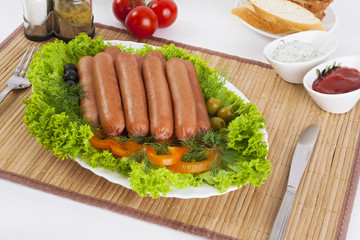 Sausages smoked with tomatoes, cucumbers and greens. Served with black or white bread.