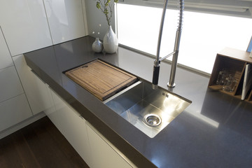kitchen sink with wood cutting board over left sink home industrial dual sinks