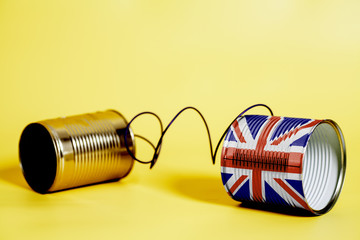 tin can phone with British flag.communication concept